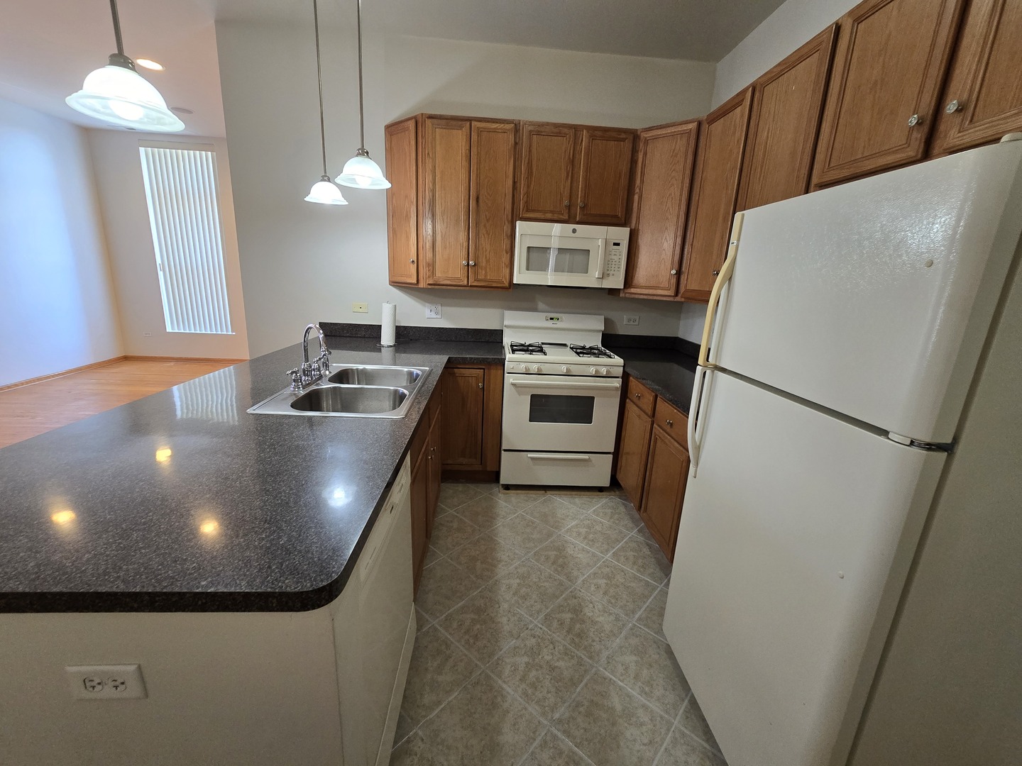 1700 West Cermak Road, Unit 2R Chicago, IL 60608 - Photo 5 of 10 a kitchen with refrigerator and stove