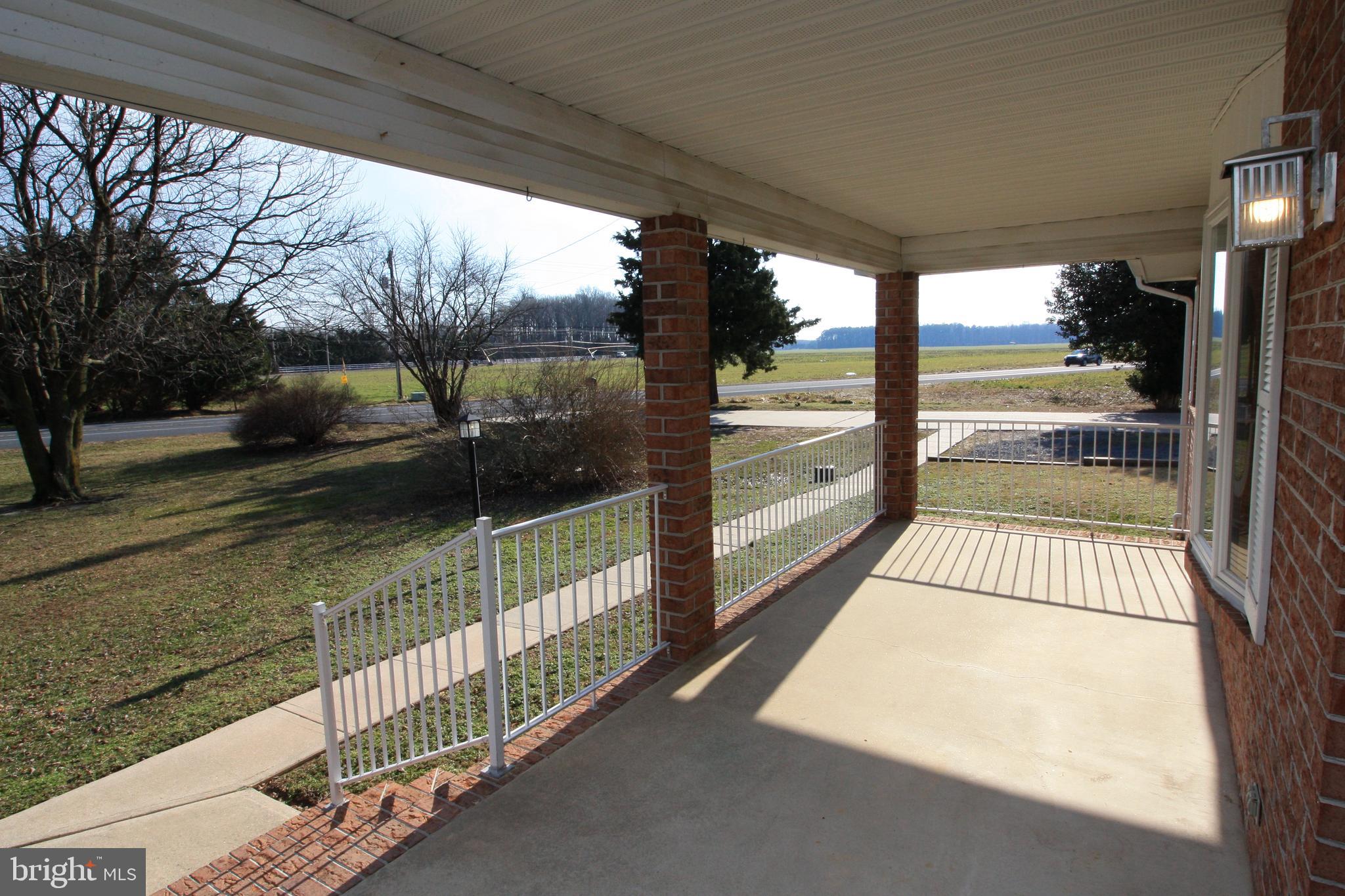28533 Cave Neck Road Milton, DE 19968 - Photo 2 of 32 Front porch looking towards Cave Neck Rd
