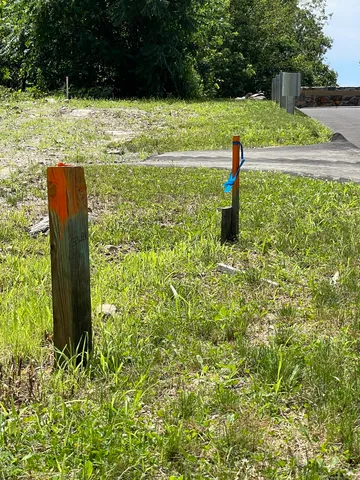 a view of a road with a houses
