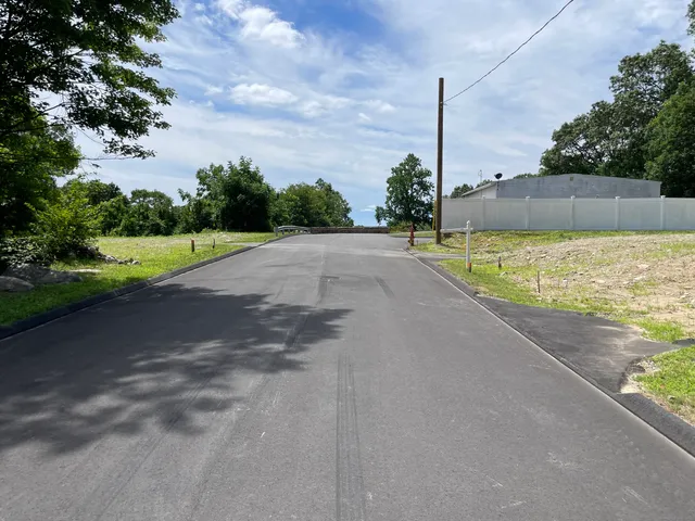 a view of a road with a yard