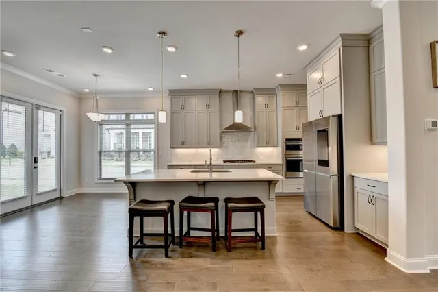 a kitchen with granite countertop a stove and a microwave