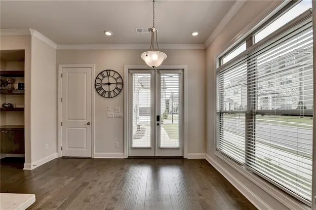 a kitchen with sink refrigerator and cabinets