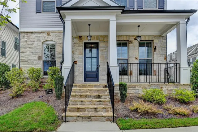 a front view of a house with a porch