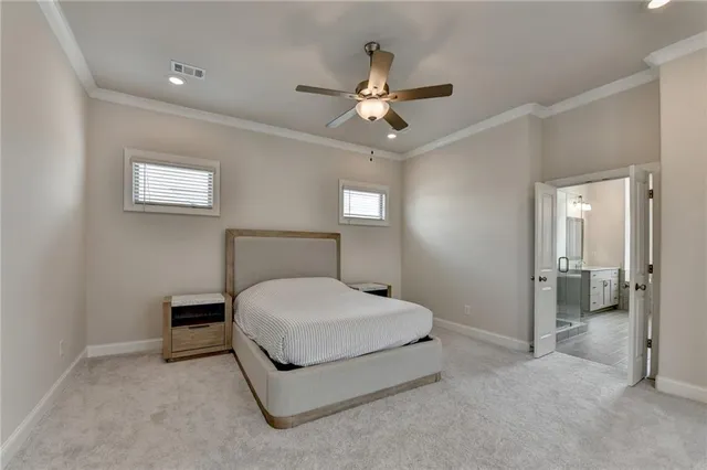 a bathroom with a tub a sink double vanity and a mirror