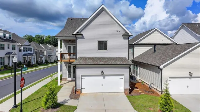 an aerial view of residential houses and swimming pool