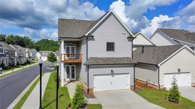 an aerial view of a tennis ground with large trees