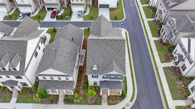 an aerial view of a house with swimming pool outdoor seating and entertaining space