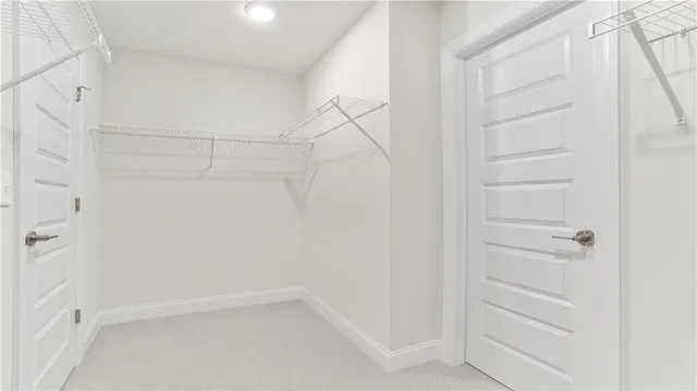 a view of an empty walk in closet