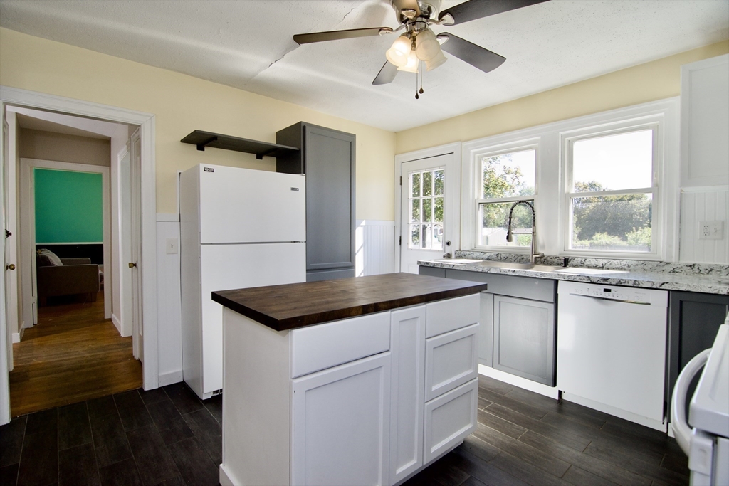 586 Granby Road South Hadley, MA 01075 - Photo 11 of 36 a kitchen with granite countertop a sink stainless steel appliances and window