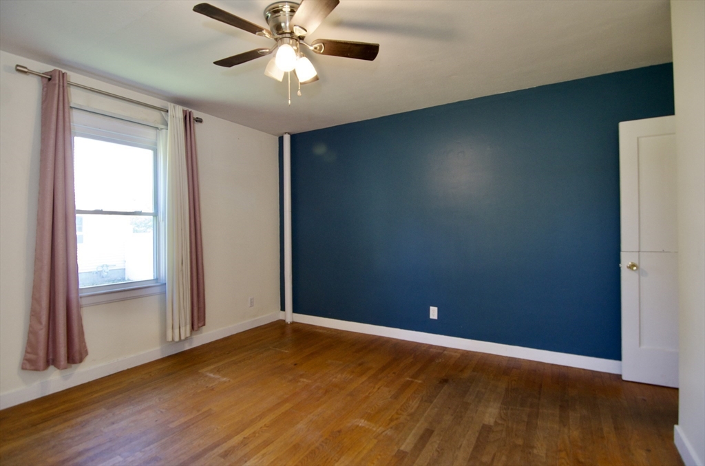 586 Granby Road South Hadley, MA 01075 - Photo 19 of 36 an empty room with wooden floor and windows