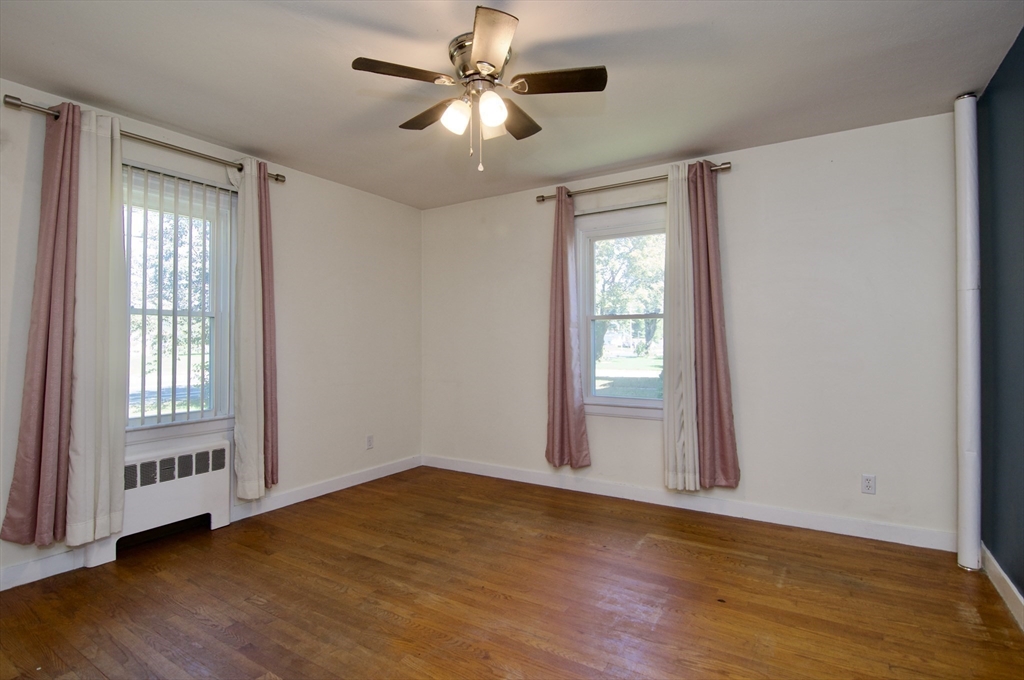 586 Granby Road South Hadley, MA 01075 - Photo 20 of 36 a view of an empty room with wooden floor and a window