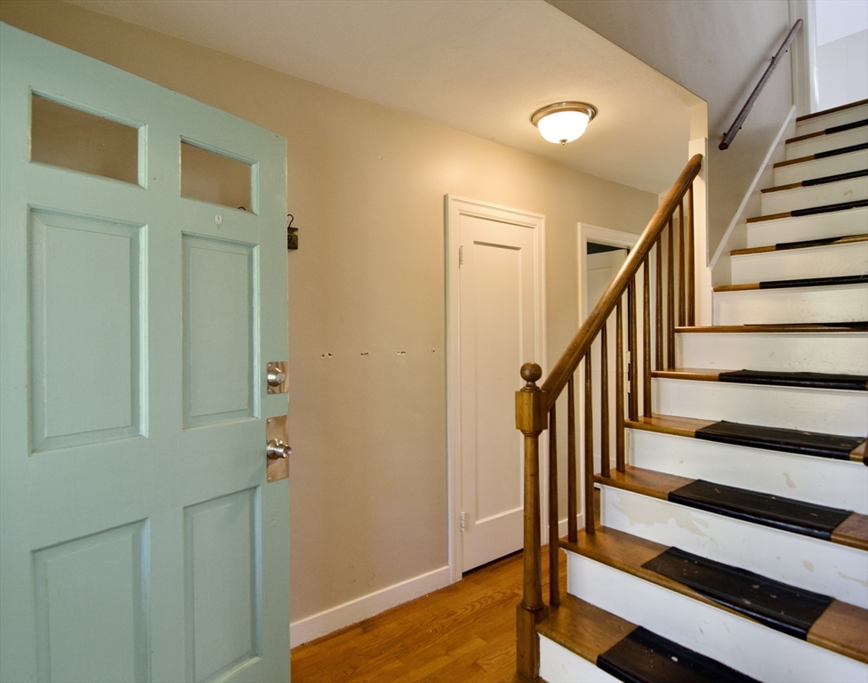 586 Granby Road South Hadley, MA 01075 - Photo 2 of 36 a view of entryway with wooden floor and stairs