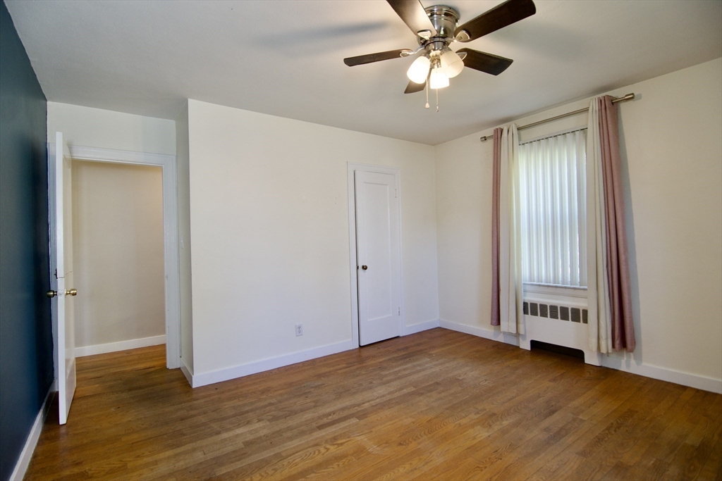 586 Granby Road South Hadley, MA 01075 - Photo 23 of 36 a view of an empty room with window and wooden floor