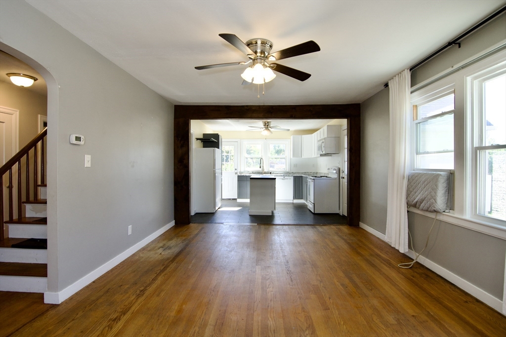 586 Granby Road South Hadley, MA 01075 - Photo 3 of 36 a view of an empty room with wooden floor and a window