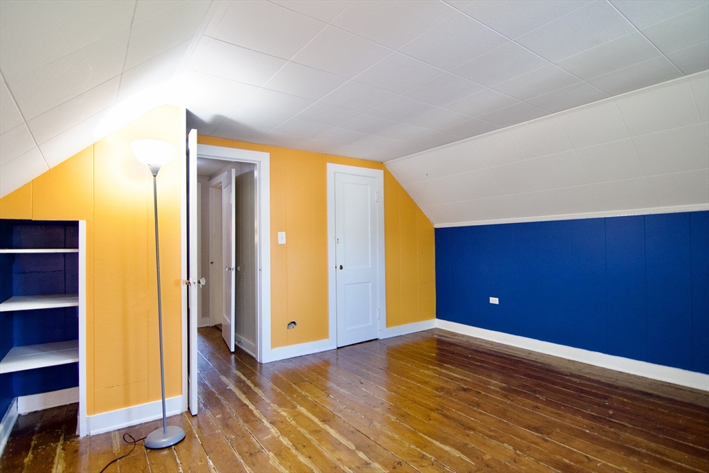 586 Granby Road South Hadley, MA 01075 - Photo 33 of 36 an empty room with wooden floor and windows