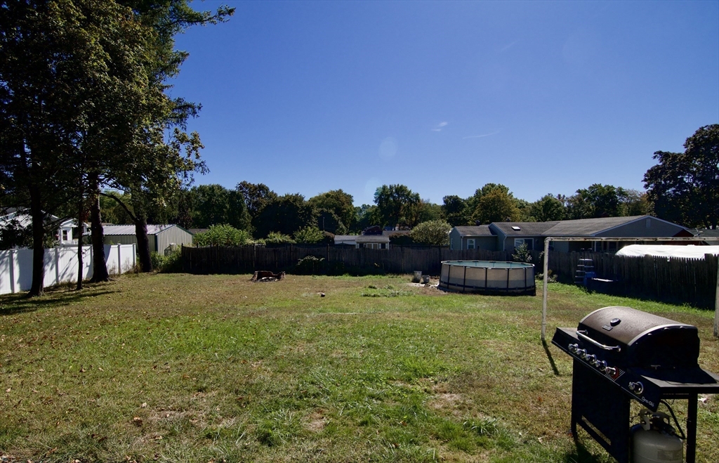586 Granby Road South Hadley, MA 01075 - Photo 34 of 36 a swimming pool with lots of trees in the background