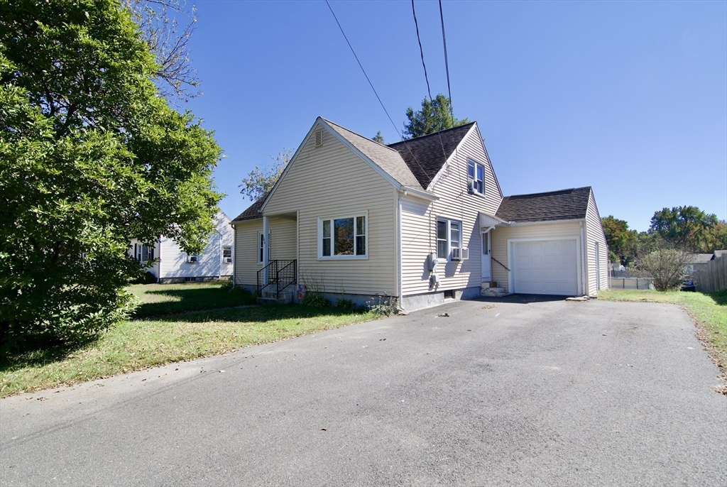 586 Granby Road South Hadley, MA 01075 - Photo 36 of 36 a front view of a house with a yard and garage