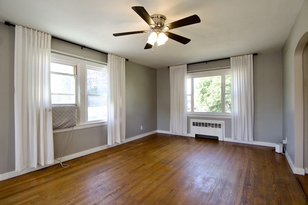 586 Granby Road South Hadley, MA 01075 - Photo 5 of 36 an empty room with wooden floor and windows