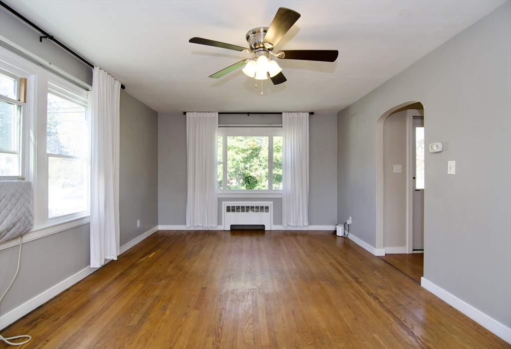 586 Granby Road South Hadley, MA 01075 - Photo 6 of 36 a view of an empty room with wooden floor and a window