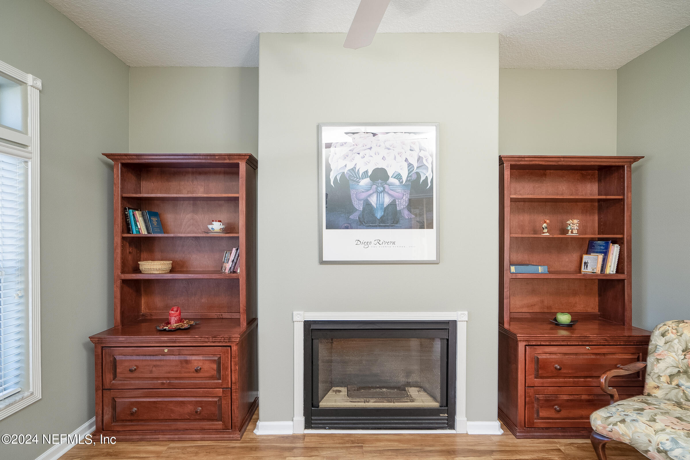 165 Cedar Ridge Circle St. Augustine, FL 32080 - Photo 13 of 45 a living room with furniture and a fireplace