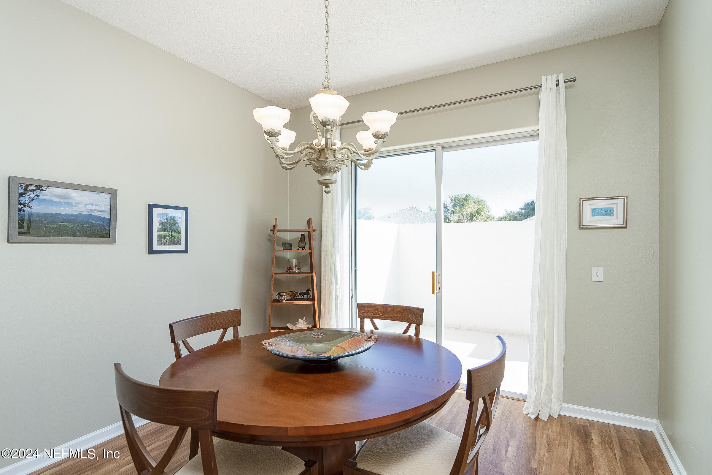 165 Cedar Ridge Circle St. Augustine, FL 32080 - Photo 18 of 45 a view of a dining room with furniture and wooden floor