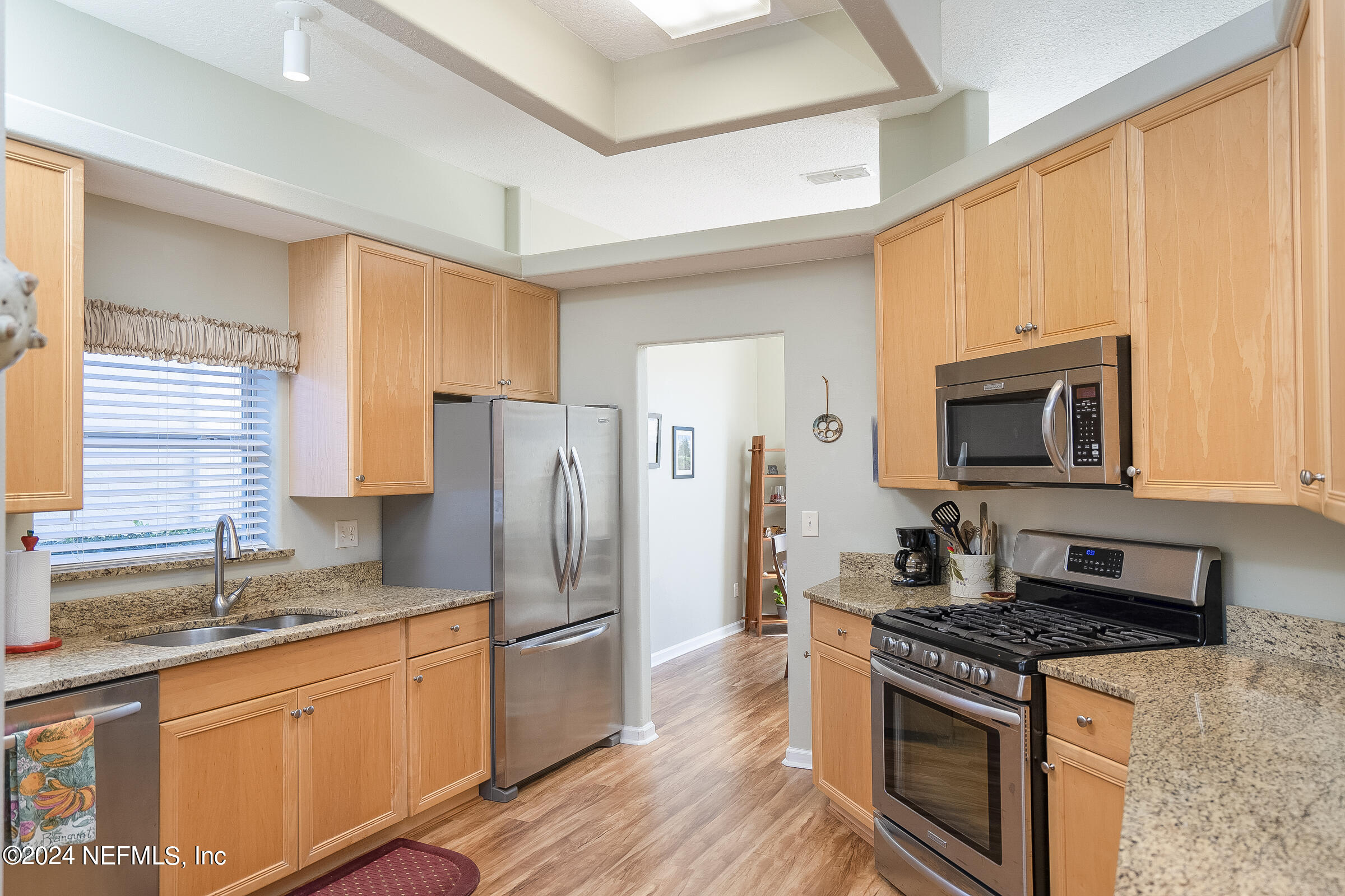 165 Cedar Ridge Circle St. Augustine, FL 32080 - Photo 2 of 45 a kitchen with stainless steel appliances granite countertop a stove a sink and a refrigerator