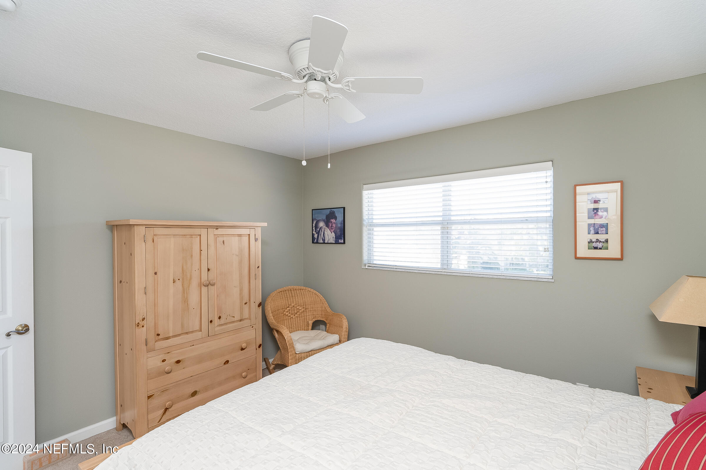 165 Cedar Ridge Circle St. Augustine, FL 32080 - Photo 26 of 45 a bedroom with a bed and a window