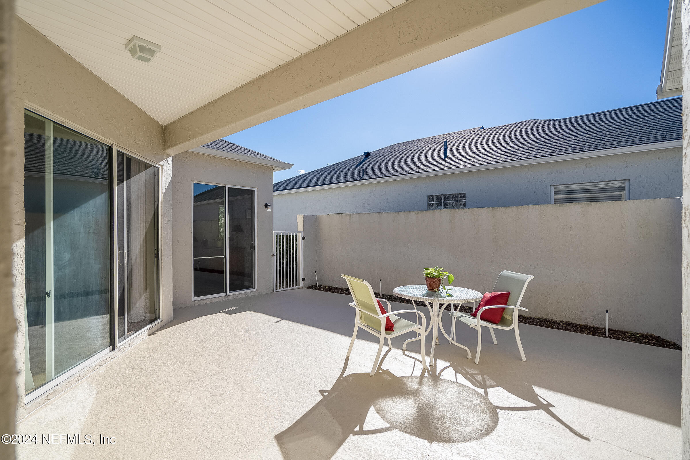 165 Cedar Ridge Circle St. Augustine, FL 32080 - Photo 28 of 45 a patio with a table and chairs