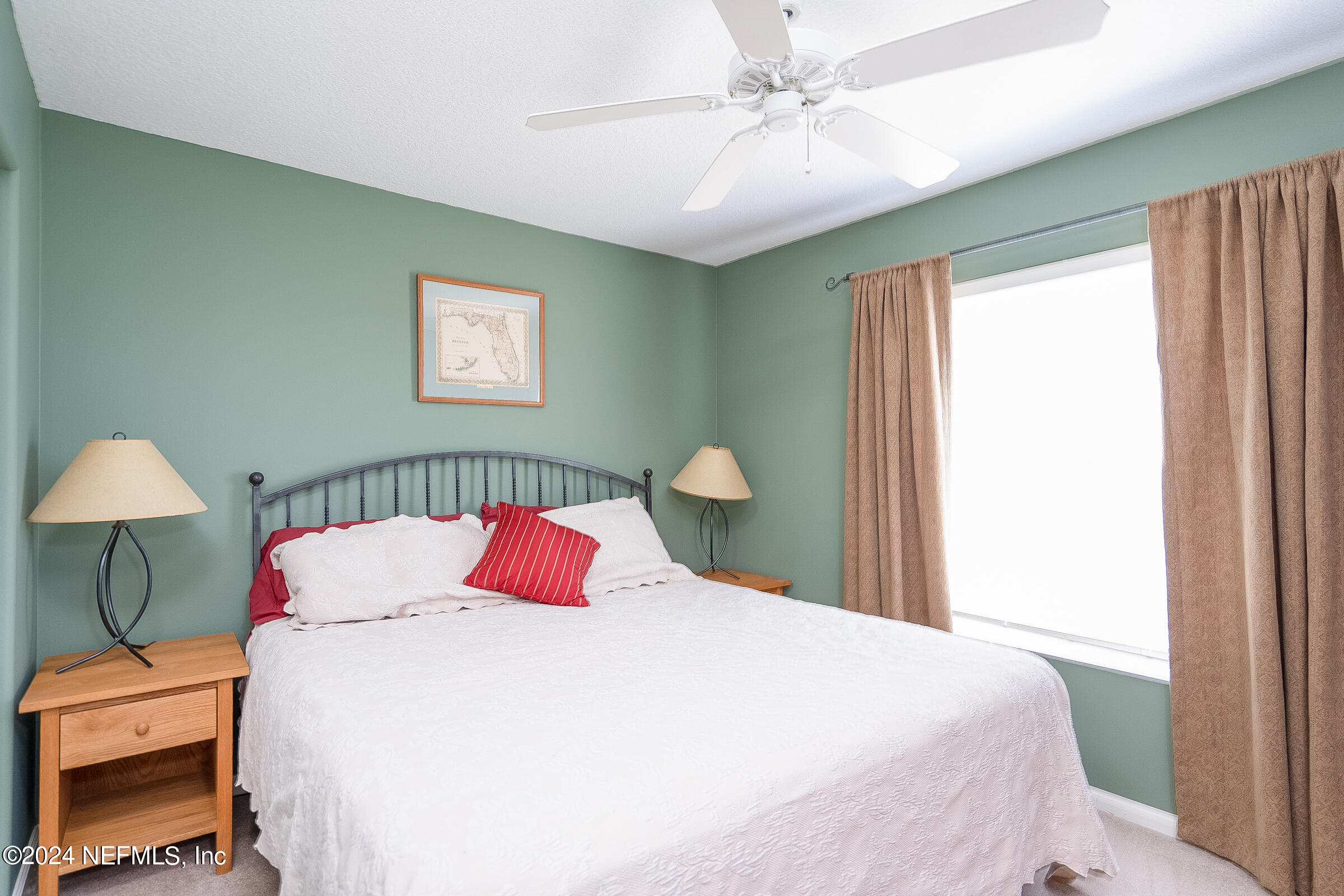 165 Cedar Ridge Circle St. Augustine, FL 32080 - Photo 31 of 45 a bedroom with a bed and a chandelier