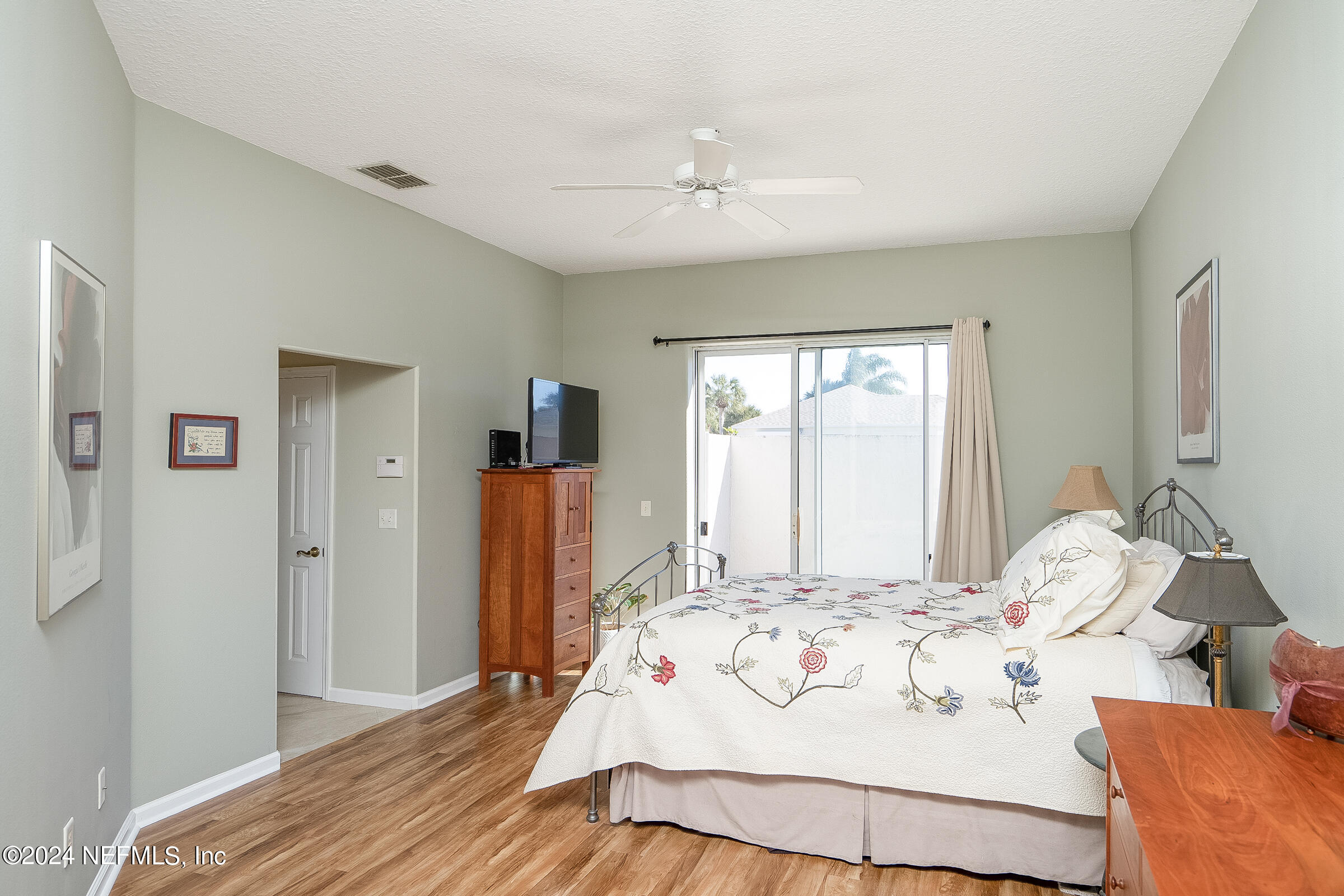 165 Cedar Ridge Circle St. Augustine, FL 32080 - Photo 5 of 45 a bedroom with a bed and a large mirror