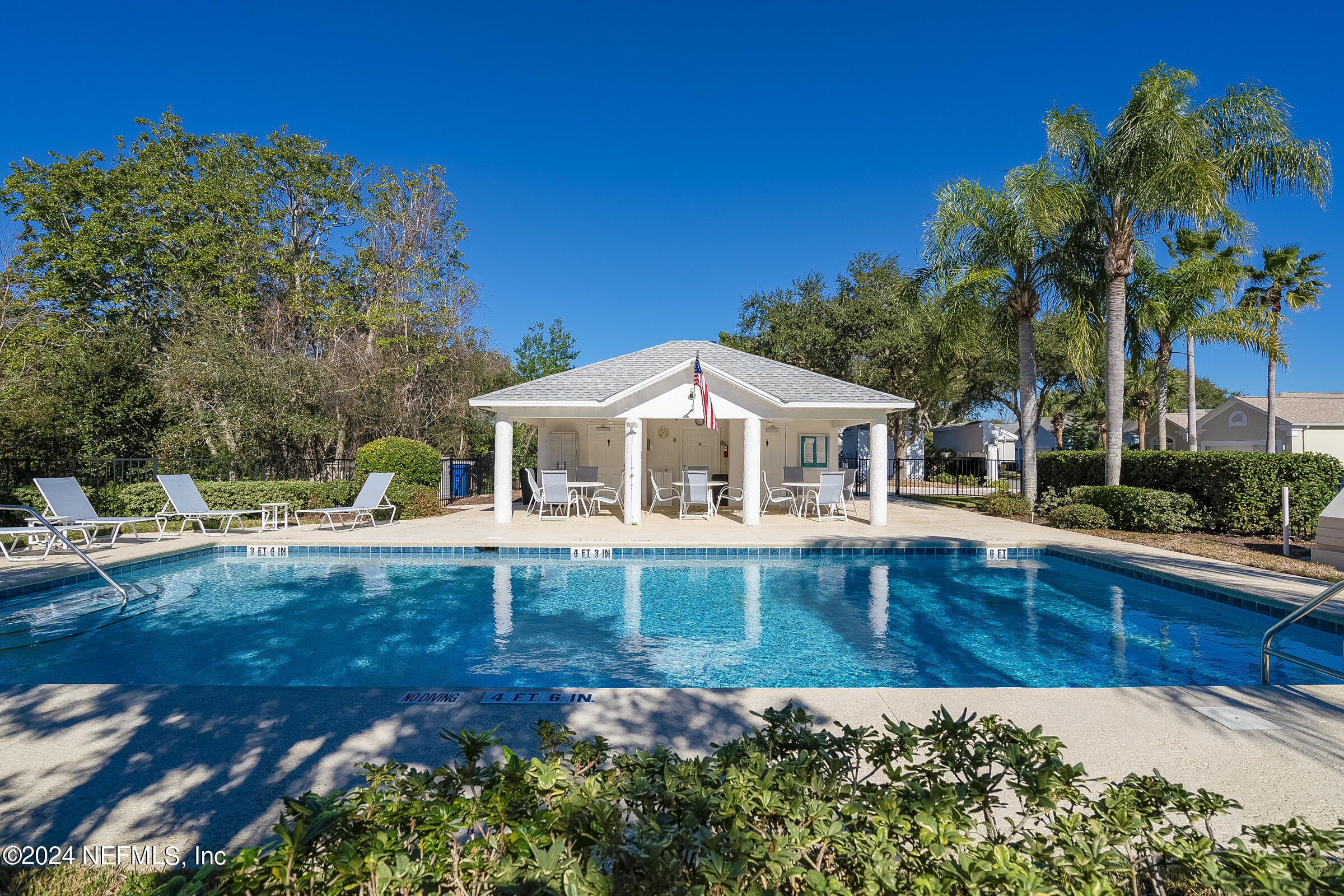 165 Cedar Ridge Circle St. Augustine, FL 32080 - Photo 7 of 45 a front view of a house with swimming pool having outdoor seating