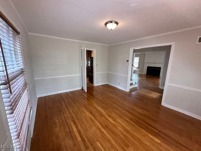 4065 Conover Road Cleveland, OH 44118 - Photo 8 of 24 Empty room featuring ornamental molding and wood-type flooring