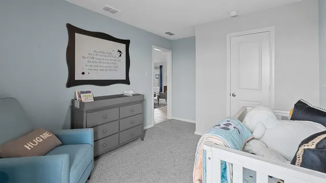 a living room with furniture and two window