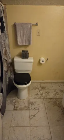 a bathroom with a toilet and a sink