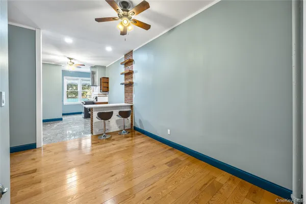 a workspace with wooden floor and a window