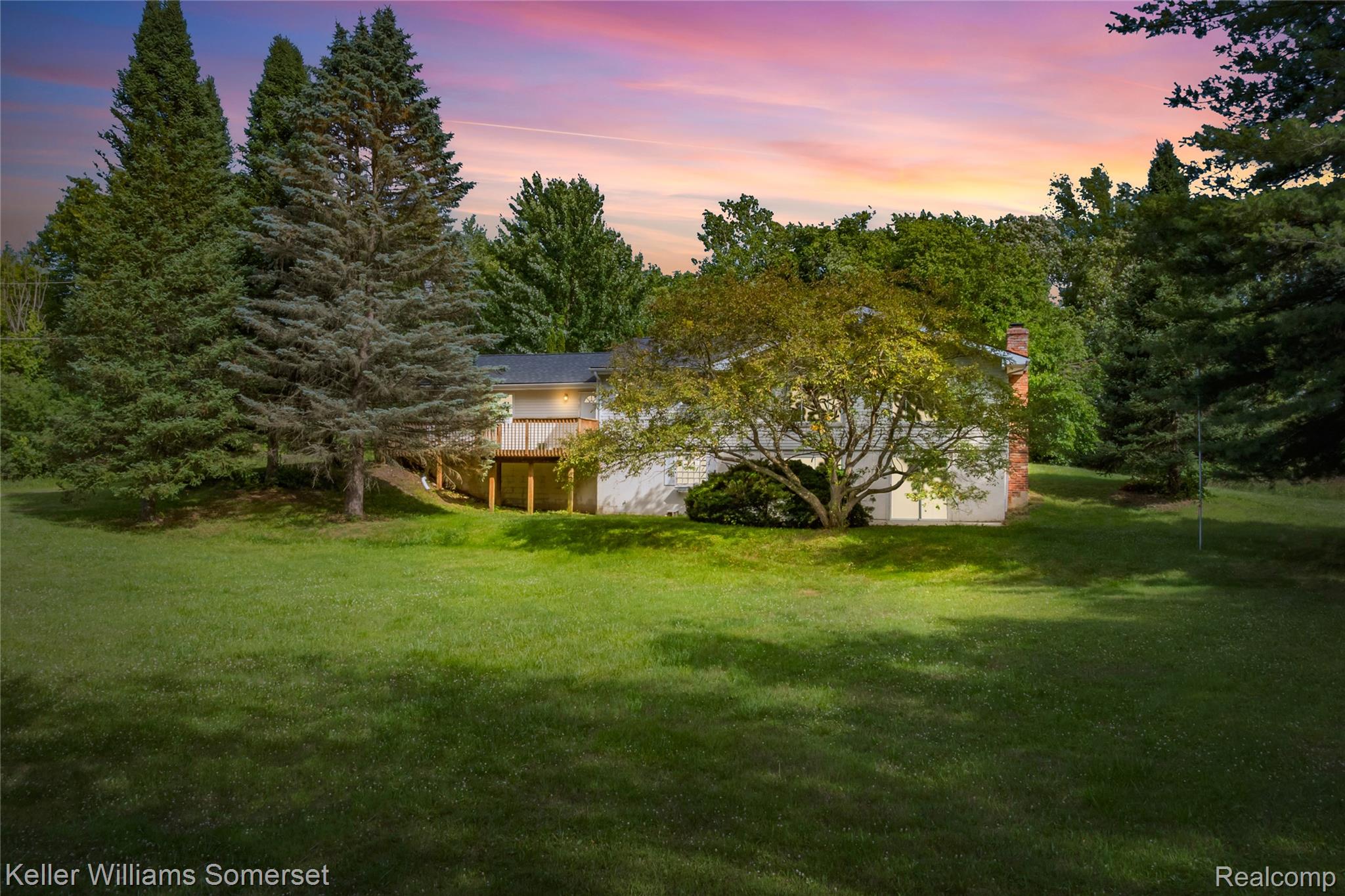 2344 Rochester Road Leonard, MI 48367 - Photo 1 of 66 Expansive rear lawn framed by mature trees