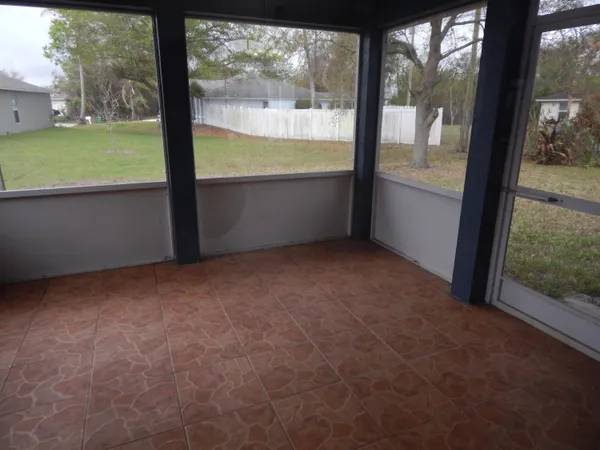 a view of an empty room with a large window
