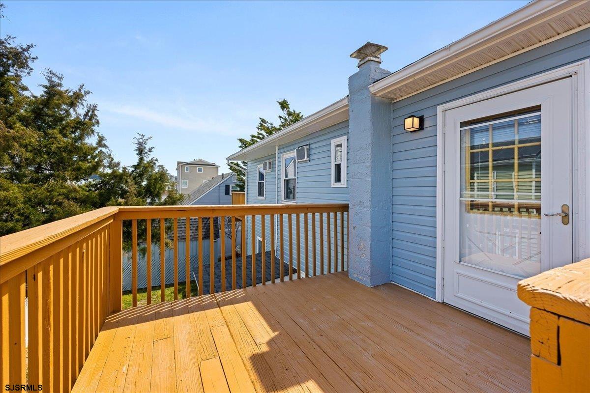 211 2nd Street South, Unit 2 Brigantine, NJ 08203 - Photo 18 of 35 a view of balcony with wooden floor