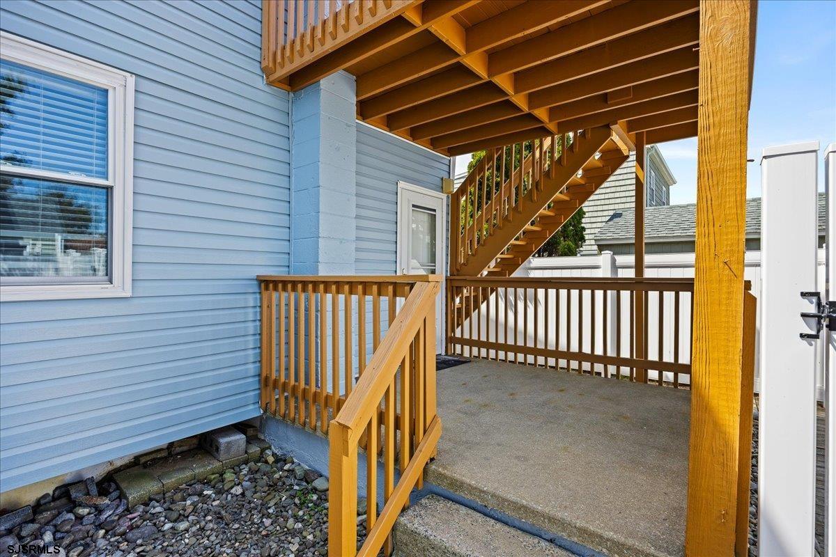 211 2nd Street South, Unit 2 Brigantine, NJ 08203 - Photo 23 of 35 a view of a backyard with a deck