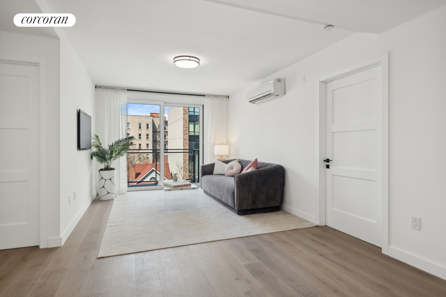 wooden floor in an empty room with a window
