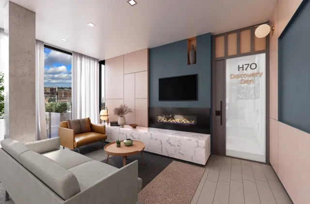 a living room with furniture and floor to ceiling windows