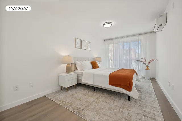 a bedroom with a bed and a couch