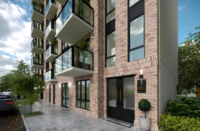 a front view of a building with a street