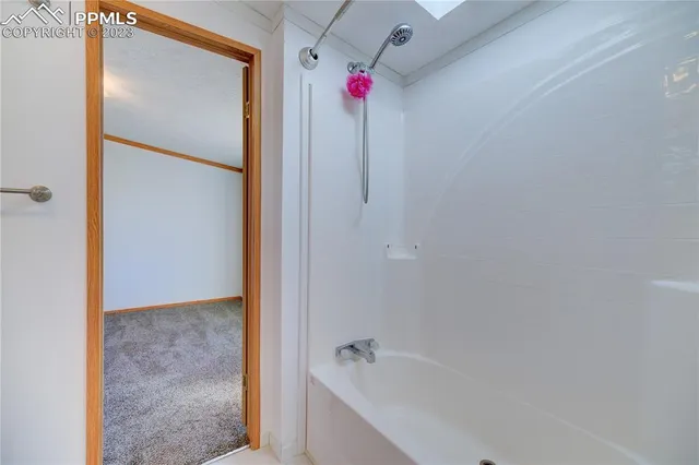 a large kitchen with stainless steel appliances granite countertop a lot of counter space and wooden floors