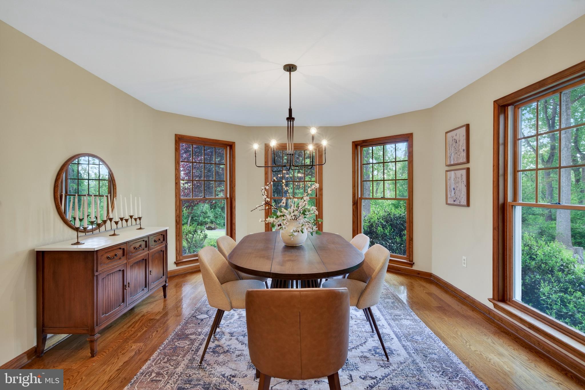 52 Atwater Road Chadds Ford, PA 19317 - Photo 15 of 85 a dining room with chandelier wooden floor a rug and a chandelier
