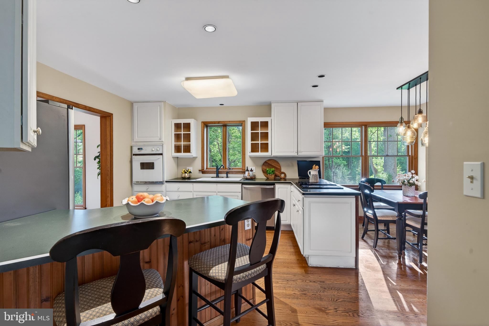 52 Atwater Road Chadds Ford, PA 19317 - Photo 16 of 85 a kitchen with stainless steel appliances kitchen island granite countertop a table chairs sink and cabinets