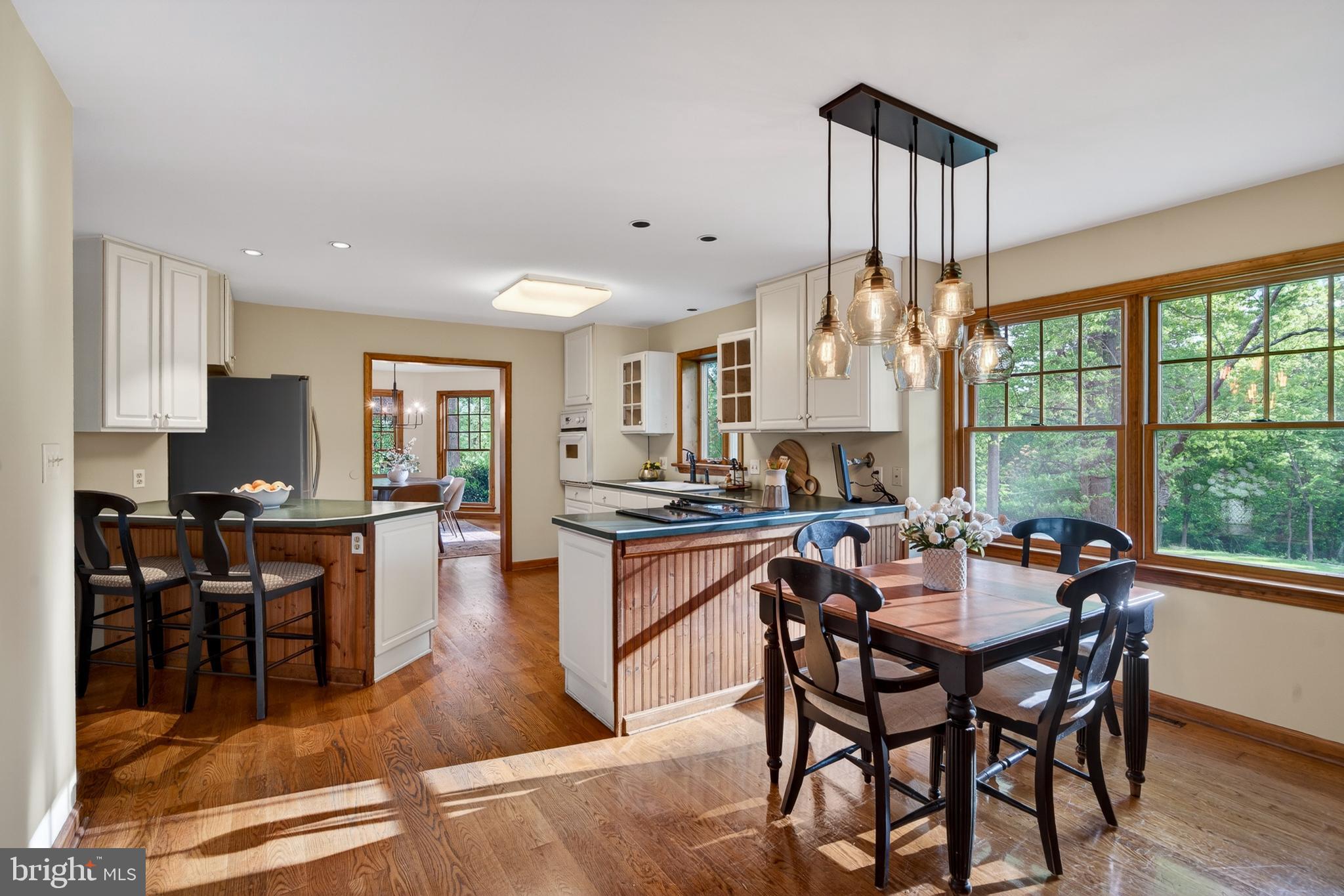 52 Atwater Road Chadds Ford, PA 19317 - Photo 17 of 85 a dining hall with stainless steel appliances granite countertop a stove a sink a dining table and chairs