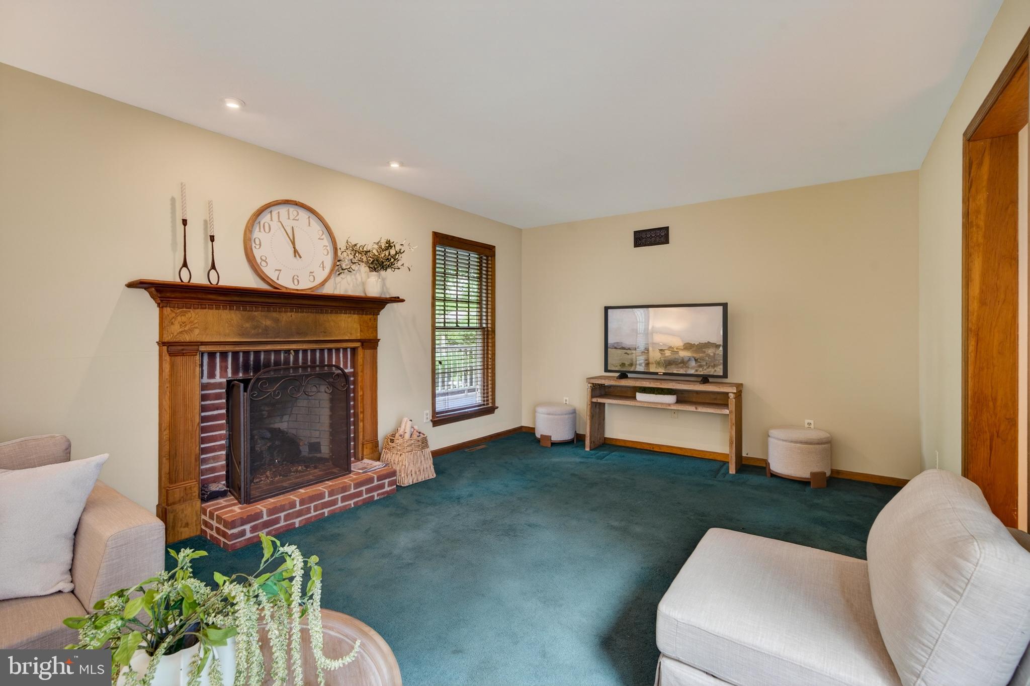 52 Atwater Road Chadds Ford, PA 19317 - Photo 25 of 85 a living room with furniture and a fireplace