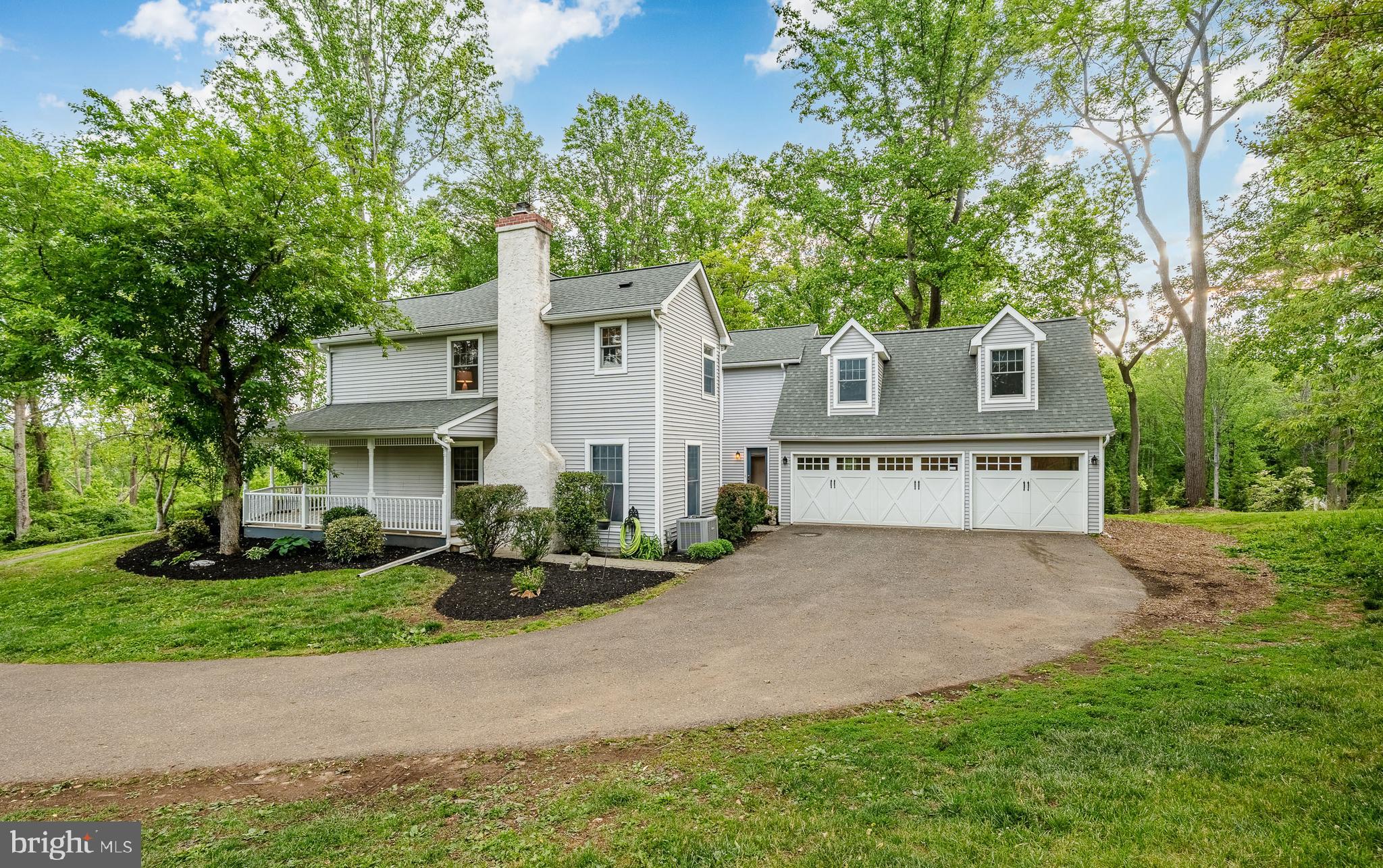 52 Atwater Road Chadds Ford, PA 19317 - Photo 62 of 85 a front view of a house with a garden and tree