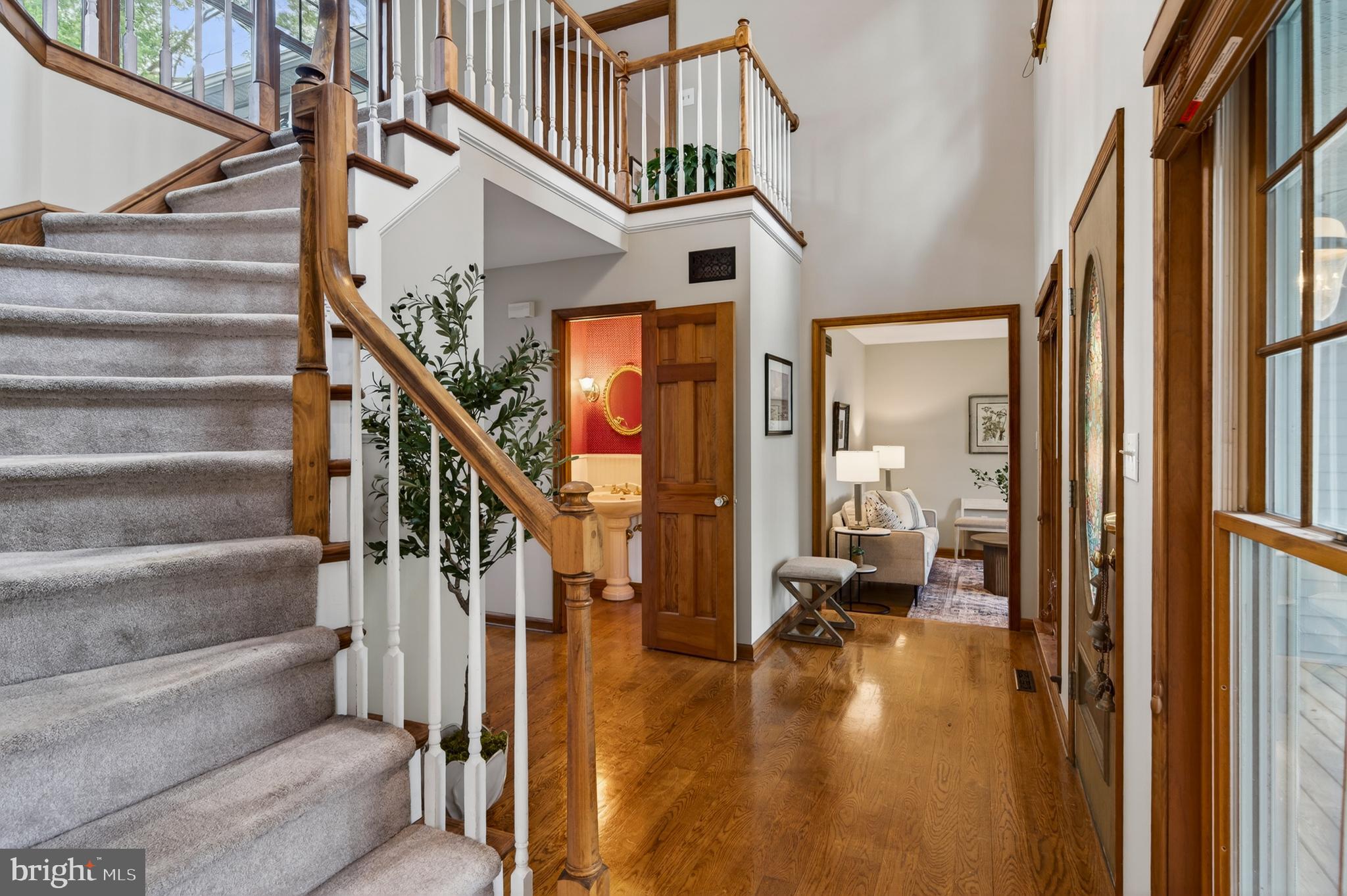 52 Atwater Road Chadds Ford, PA 19317 - Photo 7 of 85 a view of entryway and hall with wooden floor and windows